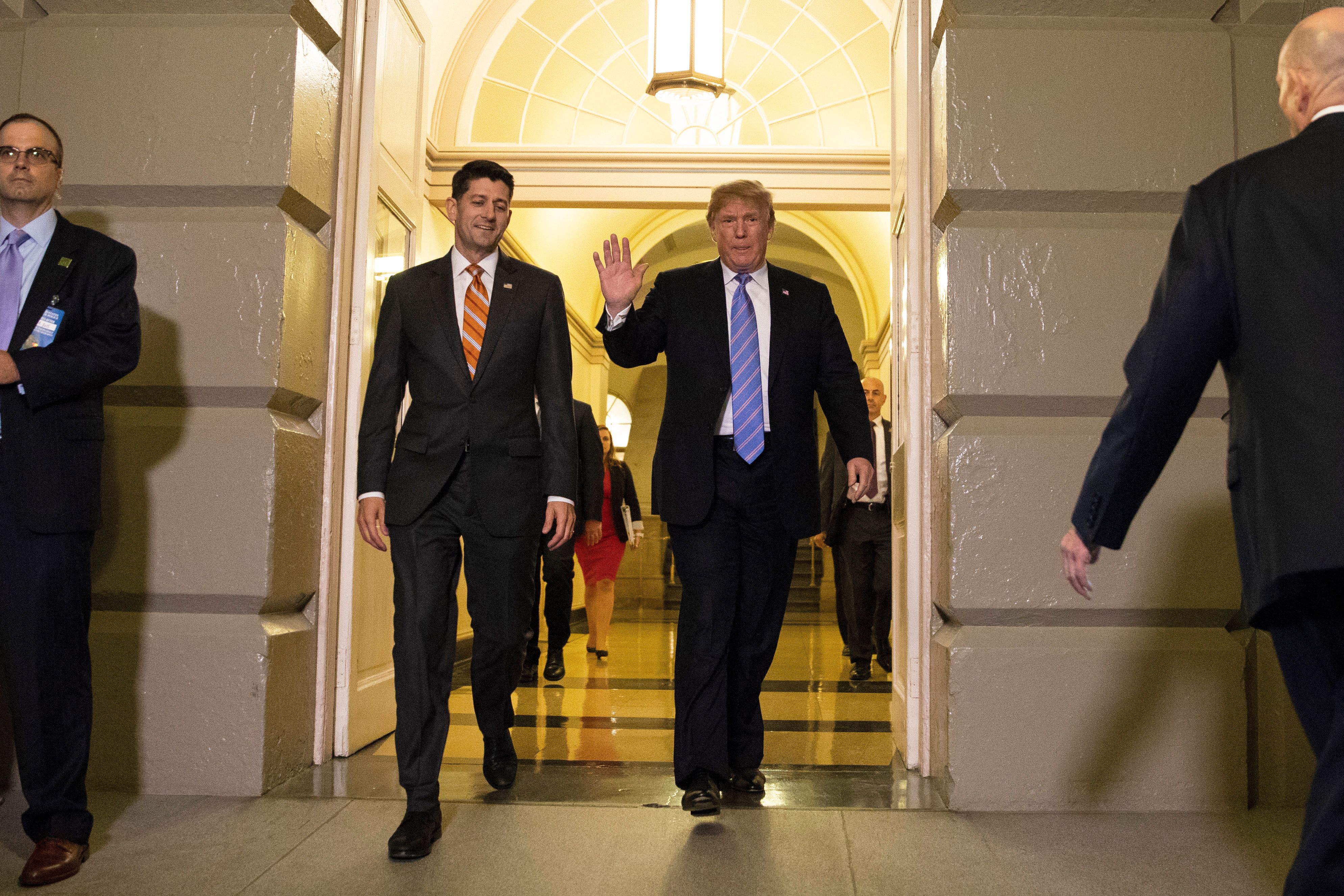 President Trump, accompanied by House Speaker Paul Ryan, arrives for a meeting with Republican members of Congress on June 19, 2018.