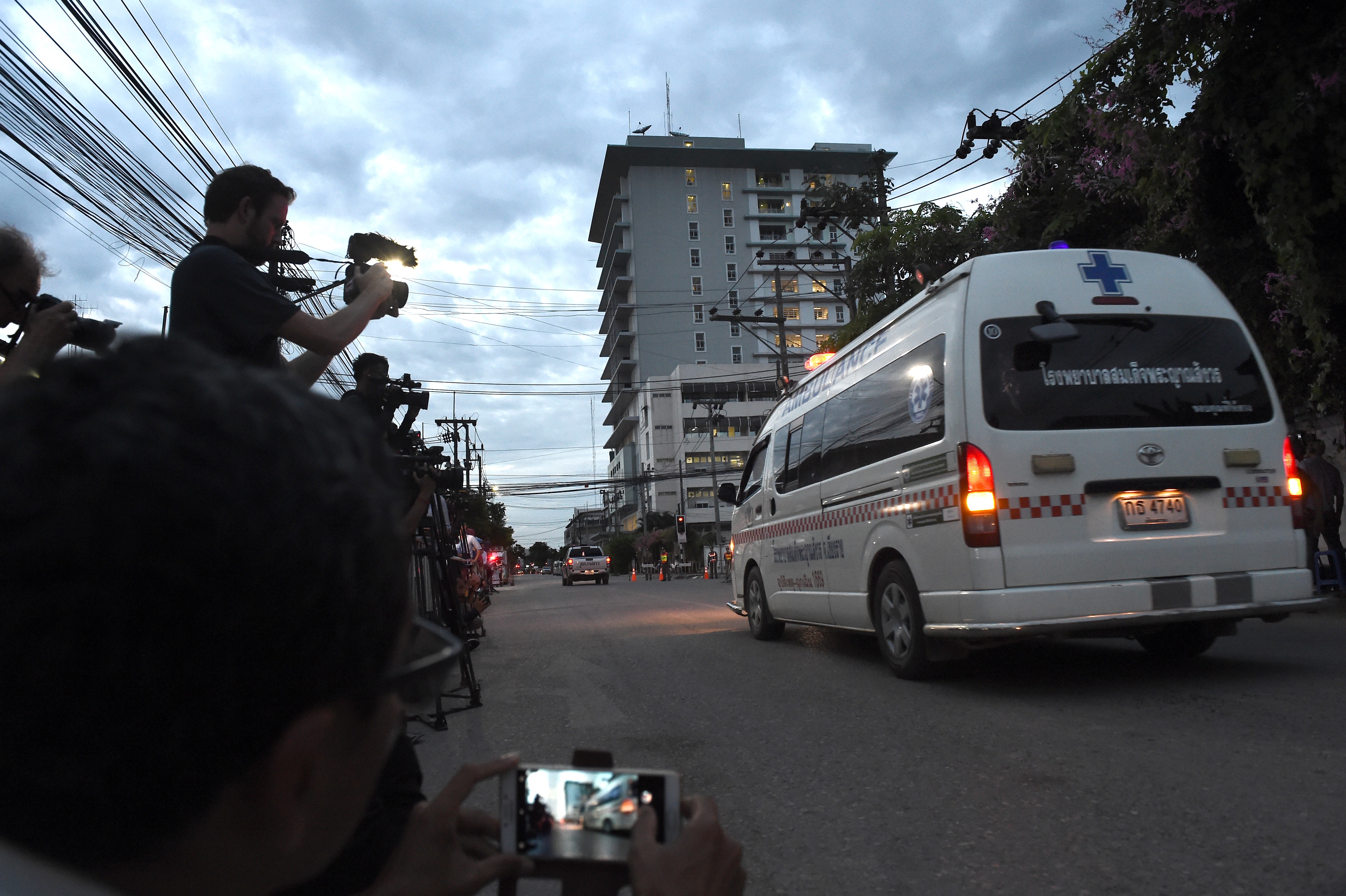 An ambulance reportedly transporting members of the soccer team approaches the hospital in Chiang Rai on July 10, 2018 after being rescued in Tham Luang cave.