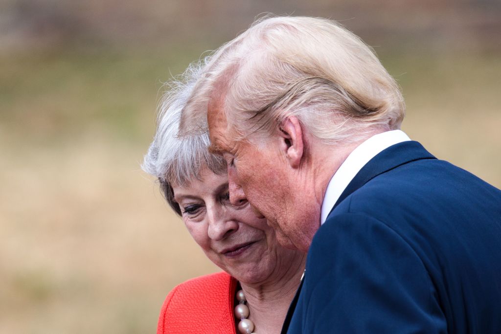 US President Donald Trump (L) and Britain's Prime Minister Theresa May (R) talk during a press conference following their meeting at Chequers on July 13, 2018.