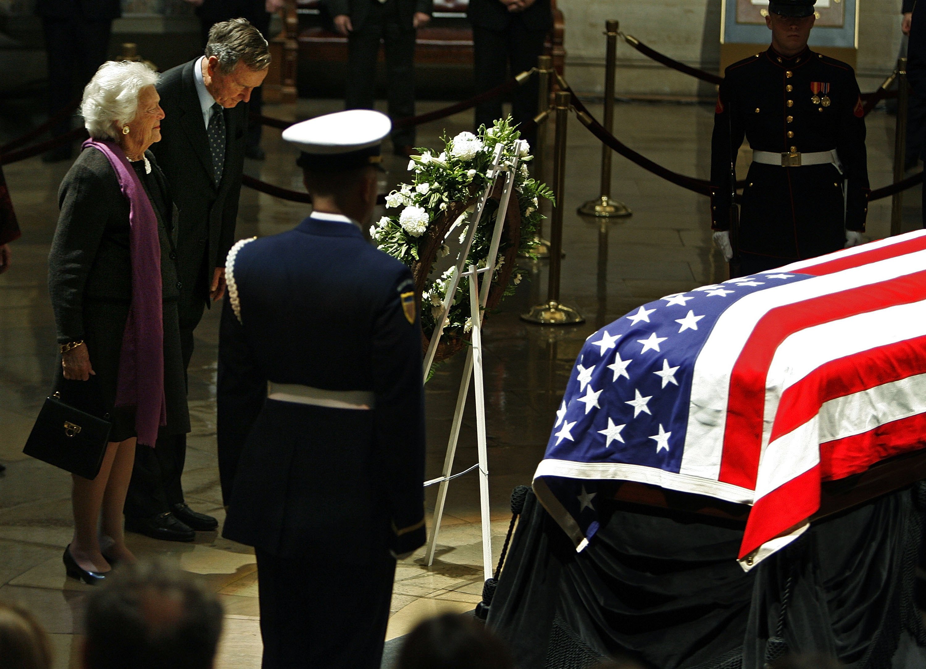 Former first lady Barbara Bush and former President George H.W. Bush pay their respects to Gerald R. Ford as his remains lie in state in the Rotunda of the US Capitol Jan. 1, 2007 
