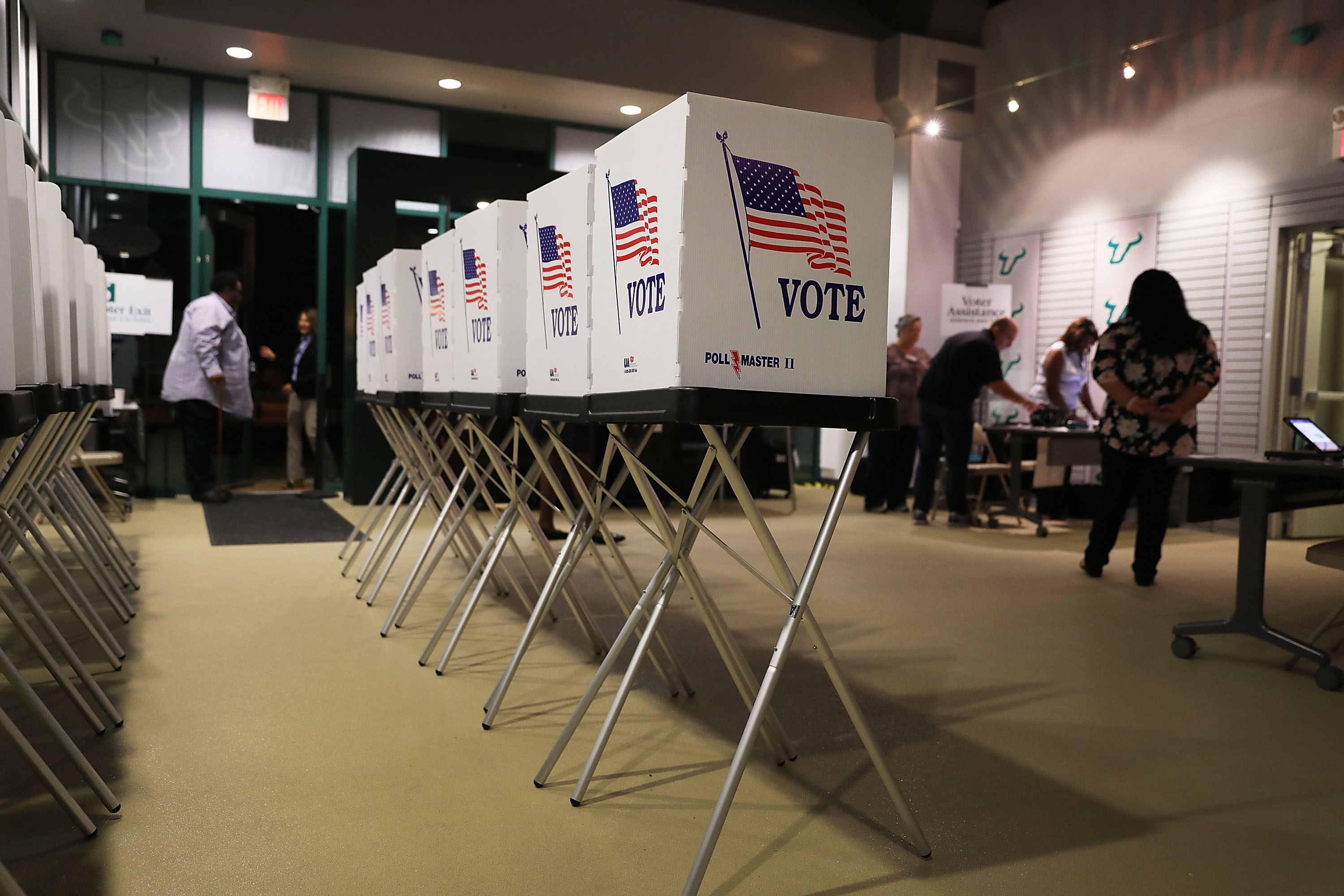 Voting booths are setup at the Yuengling center on the campus of University of South Florida as workers prepare to open the doors to early voters on Oct. 22.