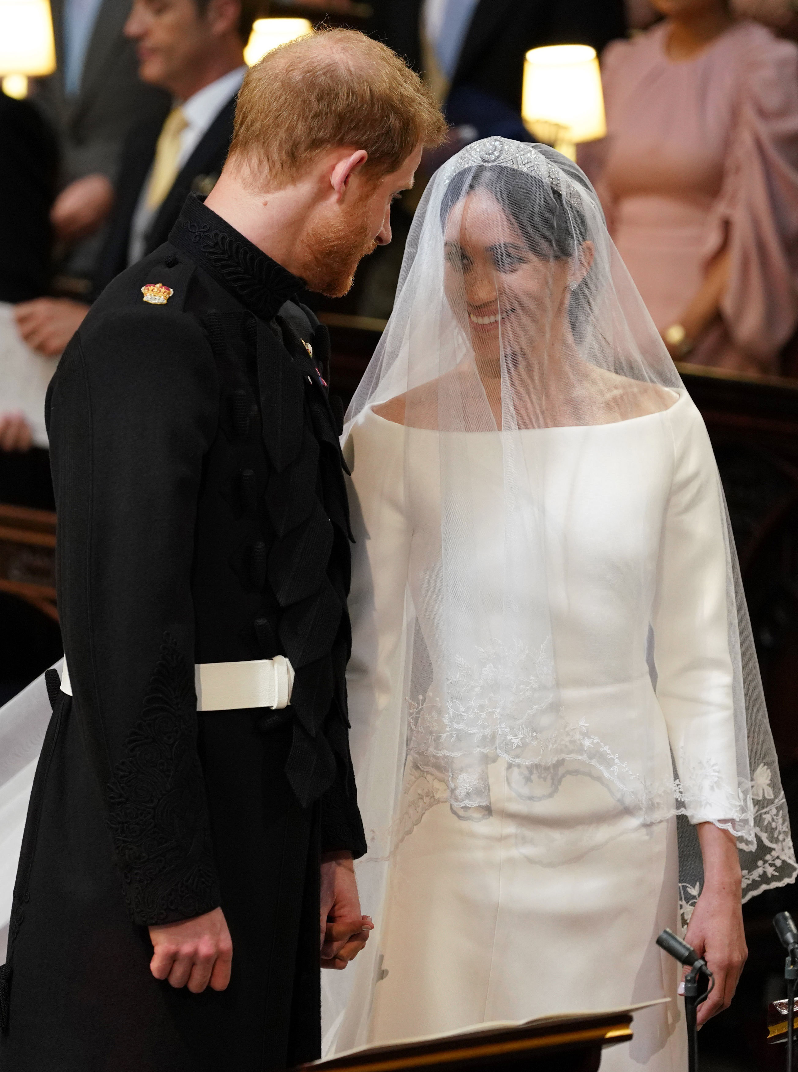The Duke and duchess of Sussex smile during their ceremony at St. George's Chapel on Saturday. 
