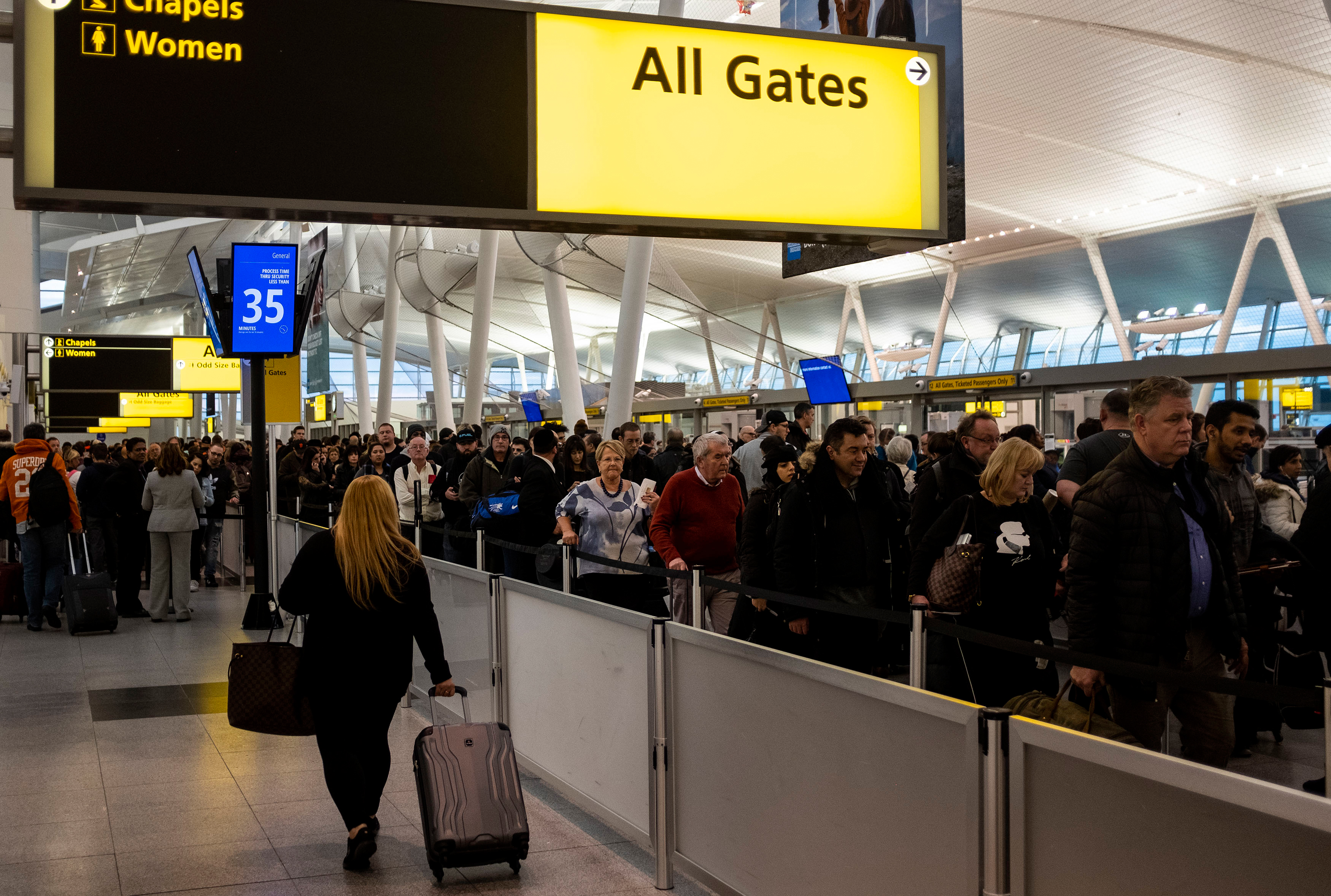 Passengers wait in a TSA line at JFK airport on Jan. 17.