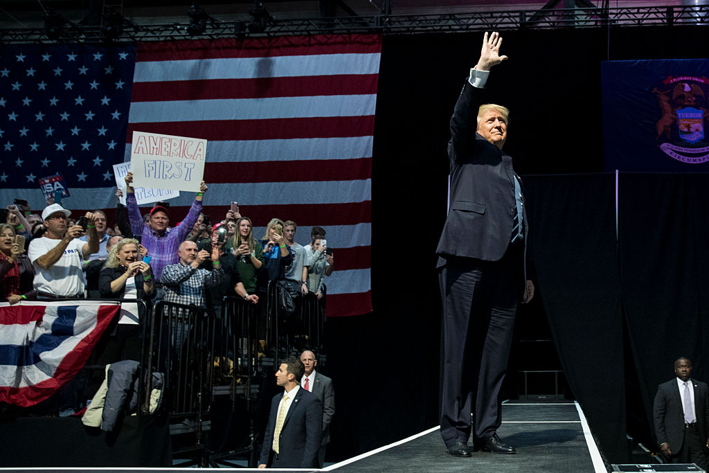 President-elect Donald Trump waves to the crowd as he arrives onstage at the DeltaPlex Arena, December 9, 2016 in Grand Rapids, Michigan. President-elect Donald Trump is continuing his victory tour across the country.