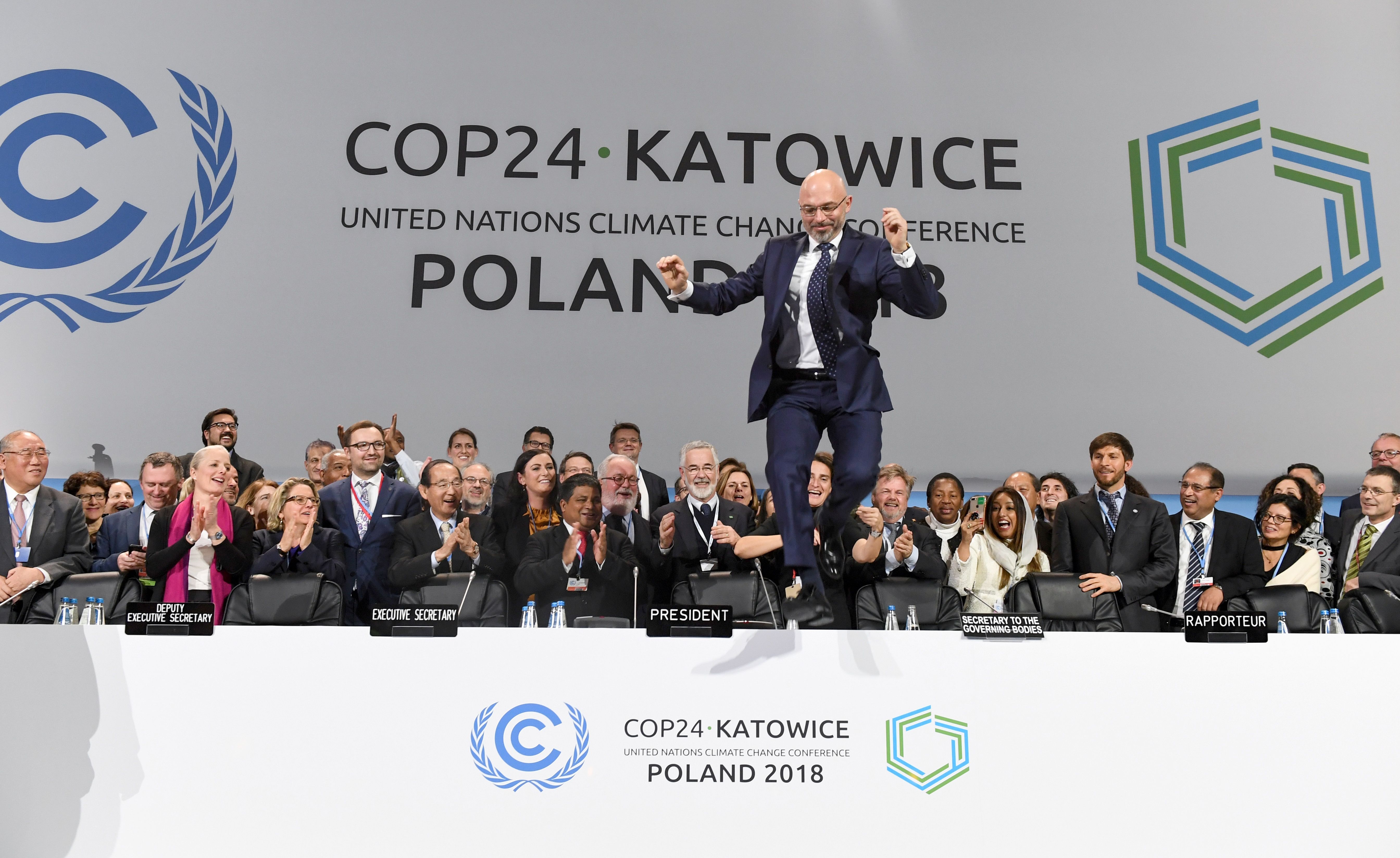 COP24 President Michal Kurtyka celebrates at the end of the conference's final session.