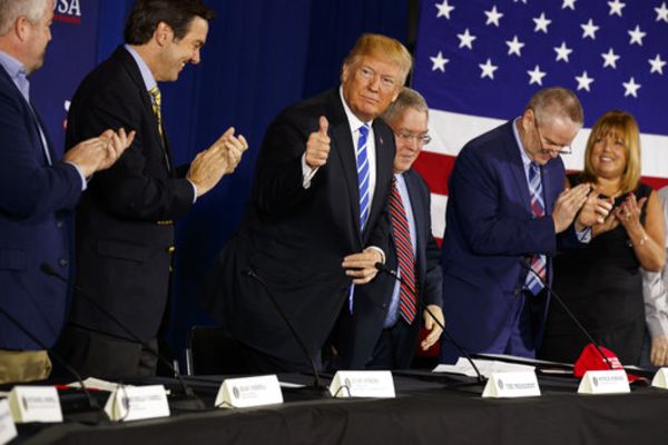 President Donald Trump gives a thumbs up during a roundtable discussion on tax policy, Thursday, April 5, 2018, in White Sulphur Springs, West Virginia.