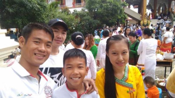 Ekkapol Ake Chantawong, the 25-year-old coach of the Wild Boars soccer team, seen with 11-year-old Chanin Viboonrungruang, who was also trapped in the cave.