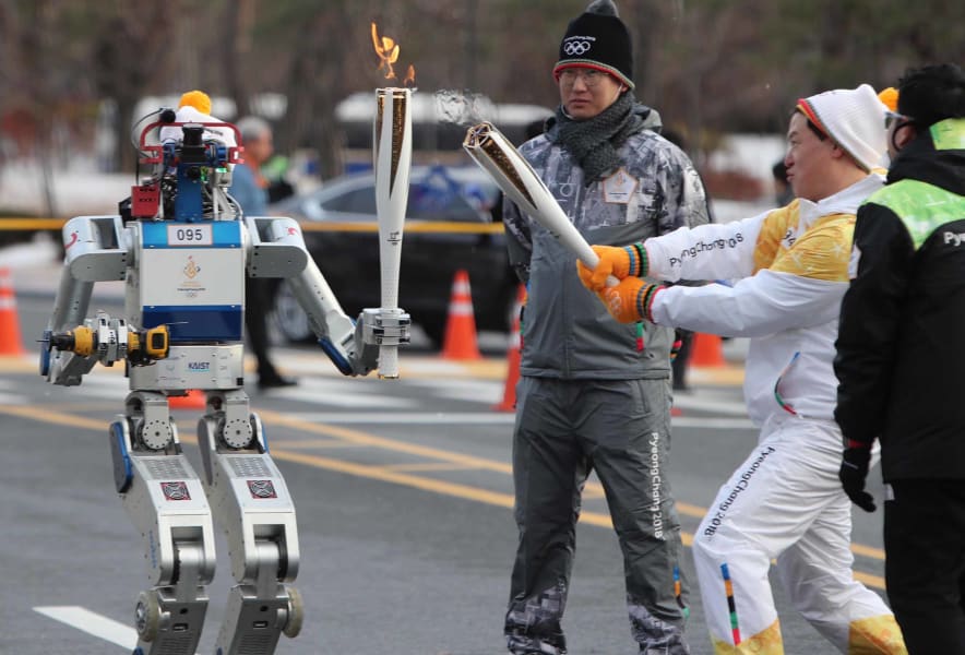 01 robot carries olympic torch 1211