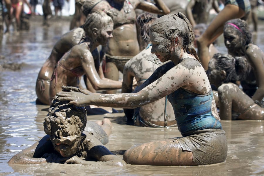 Kids Frolic In The Mud On Michigan Towns 25th Annual Mud 