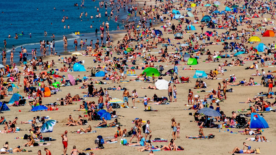 Warnings over social distancing didn't keep sun seekers away from this Netherlands beach on Thursday.