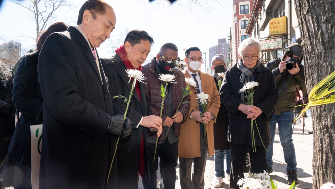 Asian American community leaders place flowers on a memorial for murder victim Christina Yuna Lee after an anti-Asian hate rally in Sarah D. Roosevelt Park Tuesday, Feb. 15, 2022 in Manhattan, New York. (Barry Williams/New York Daily News/Tribune News Service via Getty Images)