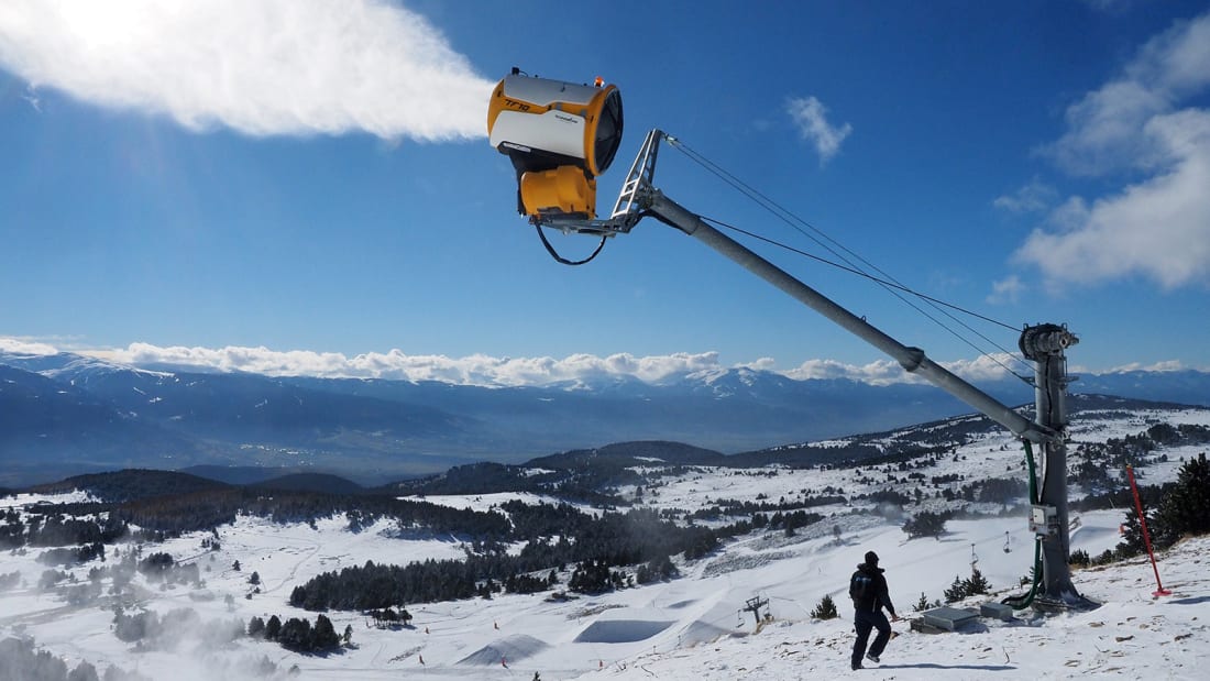 An employee of the ski resort of Font-Romeu, southern France, controls a snow gun on November 25, 2016 prior to the opening of ski hills. (Photo by RAYMOND ROIG / AFP) (Photo by RAYMOND ROIG/AFP via Getty Images)