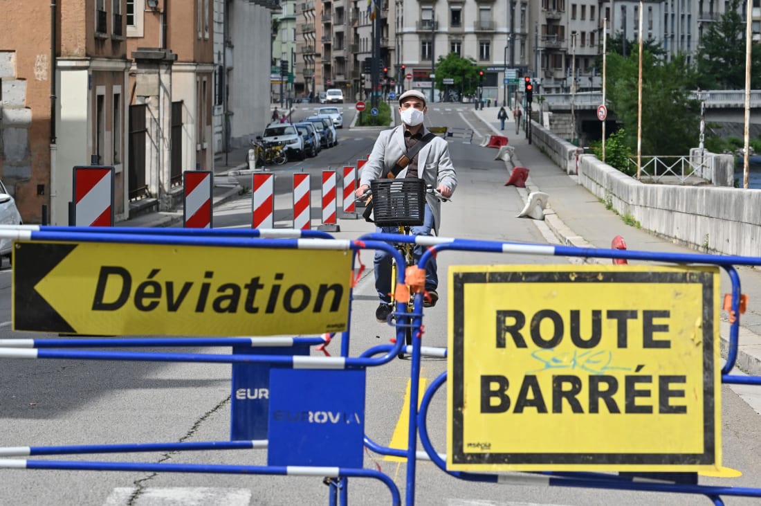 A man rides along a temporary cycle lane put into place to relieve pressure on public transportation in Grenoble, France.