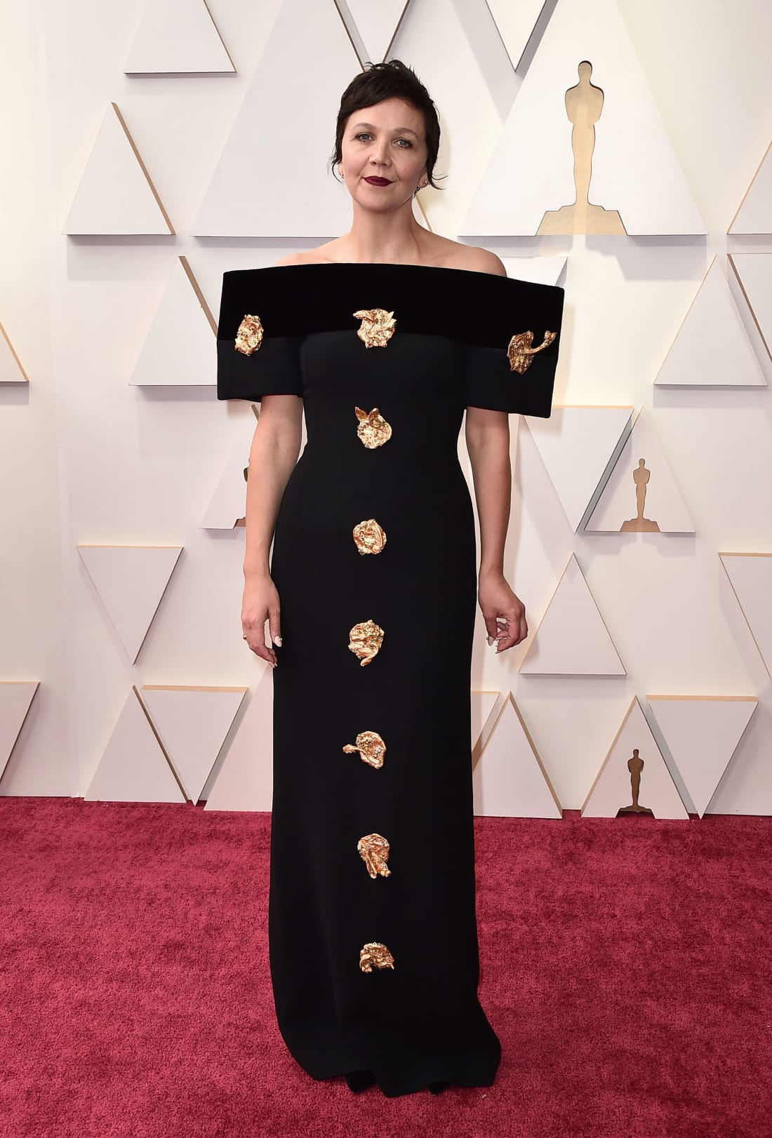 "The Lost Daughter" director and Best Adapted Screenplay nominee Maggie Gyllenhaal in custom Schiaparelli.