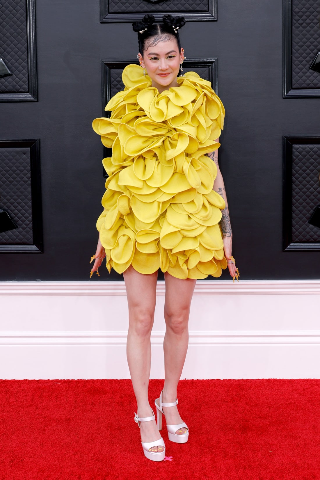 Michelle Zauner of Japanese Breakfast wore a bright yellow Valentino dress, completing the look with elaborate nail art.
