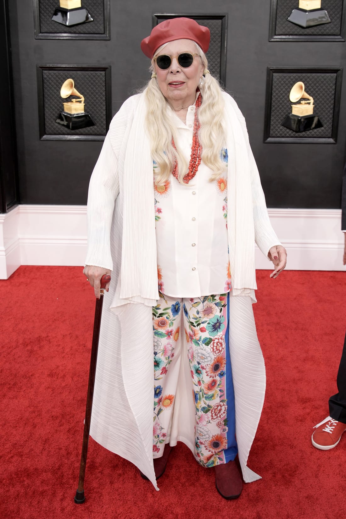 Joni Mitchell wore an all-white ensemble and a signature beret.