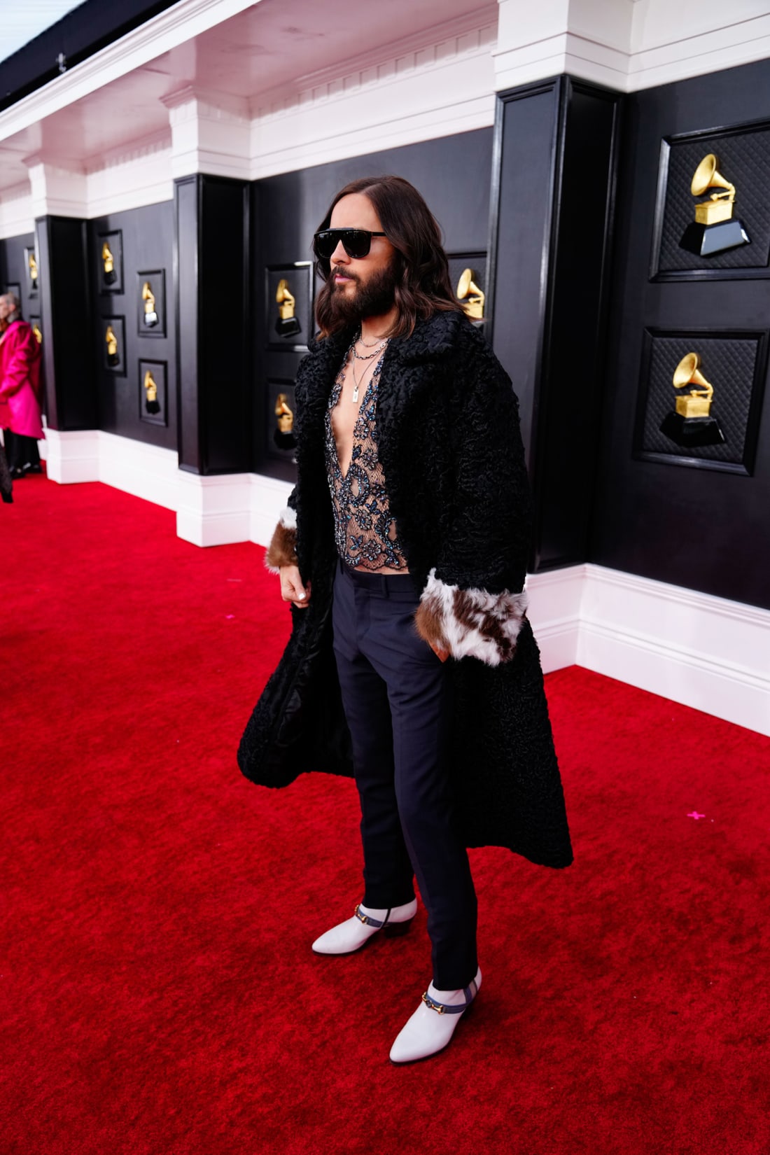 Jared Leto wore a lace top and fur-trimmed jacket by Gucci, having recently played the brand's former chief designer, Paolo, in the movie "House of Gucci."