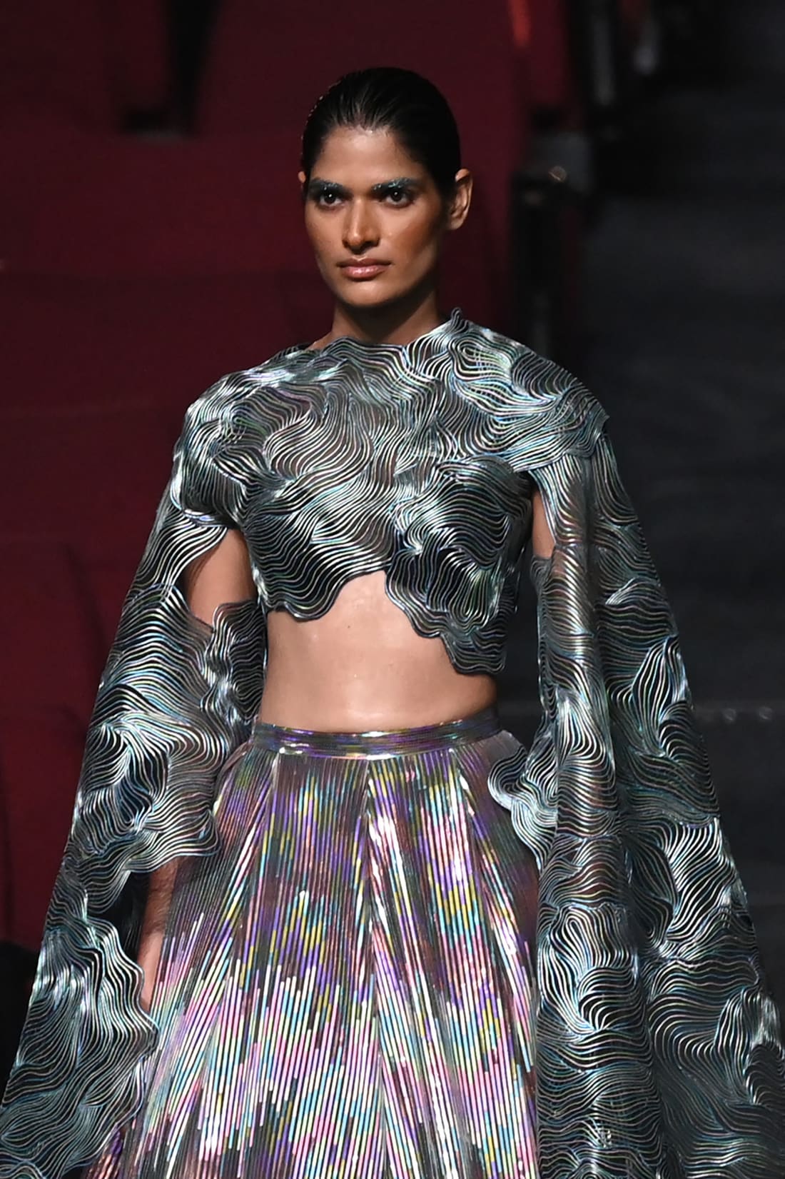 A model presents a creation by designer Amit Aggarwal during the FDCI India Couture Week in New Delhi on July 30, 2022. 