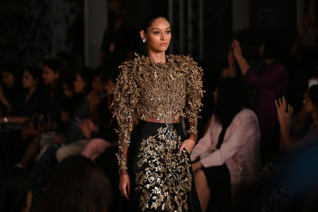 A model presents a creation by designer Rahul Mishra during the FDCI India Couture Week in New Delhi on July 23, 2022. 