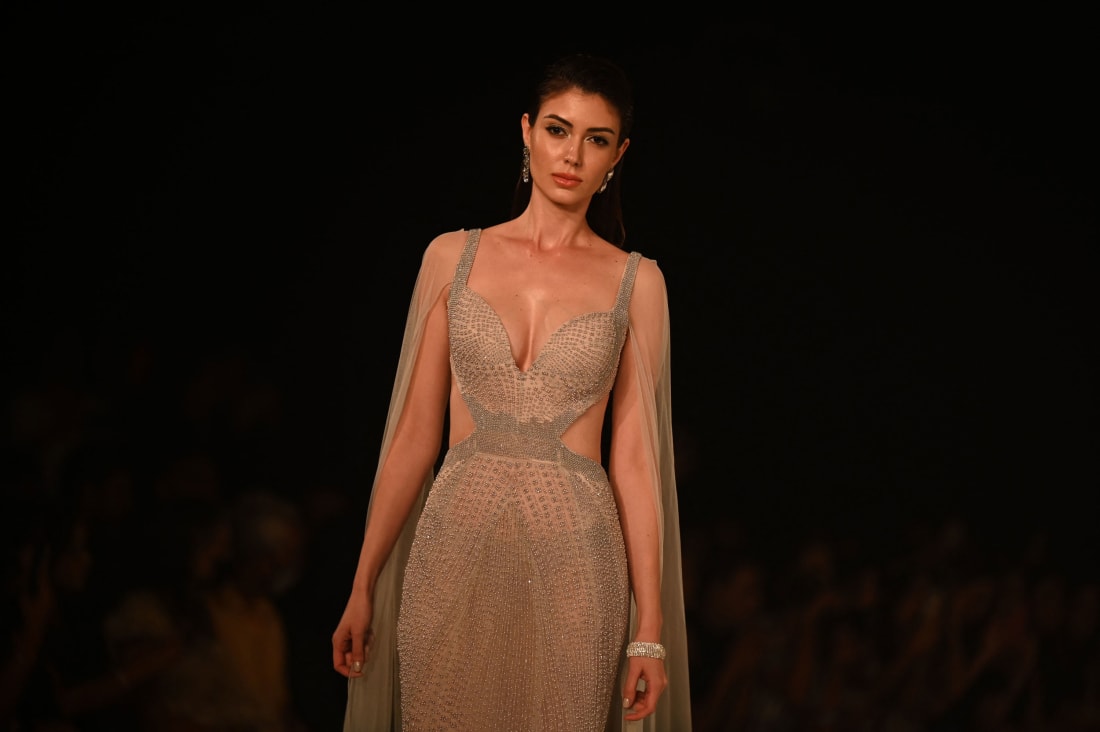 Models present creation by designers Rohit Gandhi + Rahul Khanna during the FDCI India Couture Week in New Delhi on July 27, 2022. 