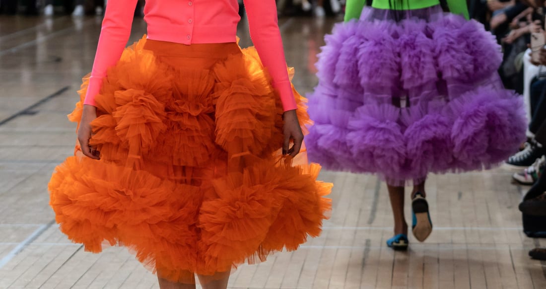 Beyond her menswear looks, Molly Goddard fashioned wide tulle skirts in highlighter neons.