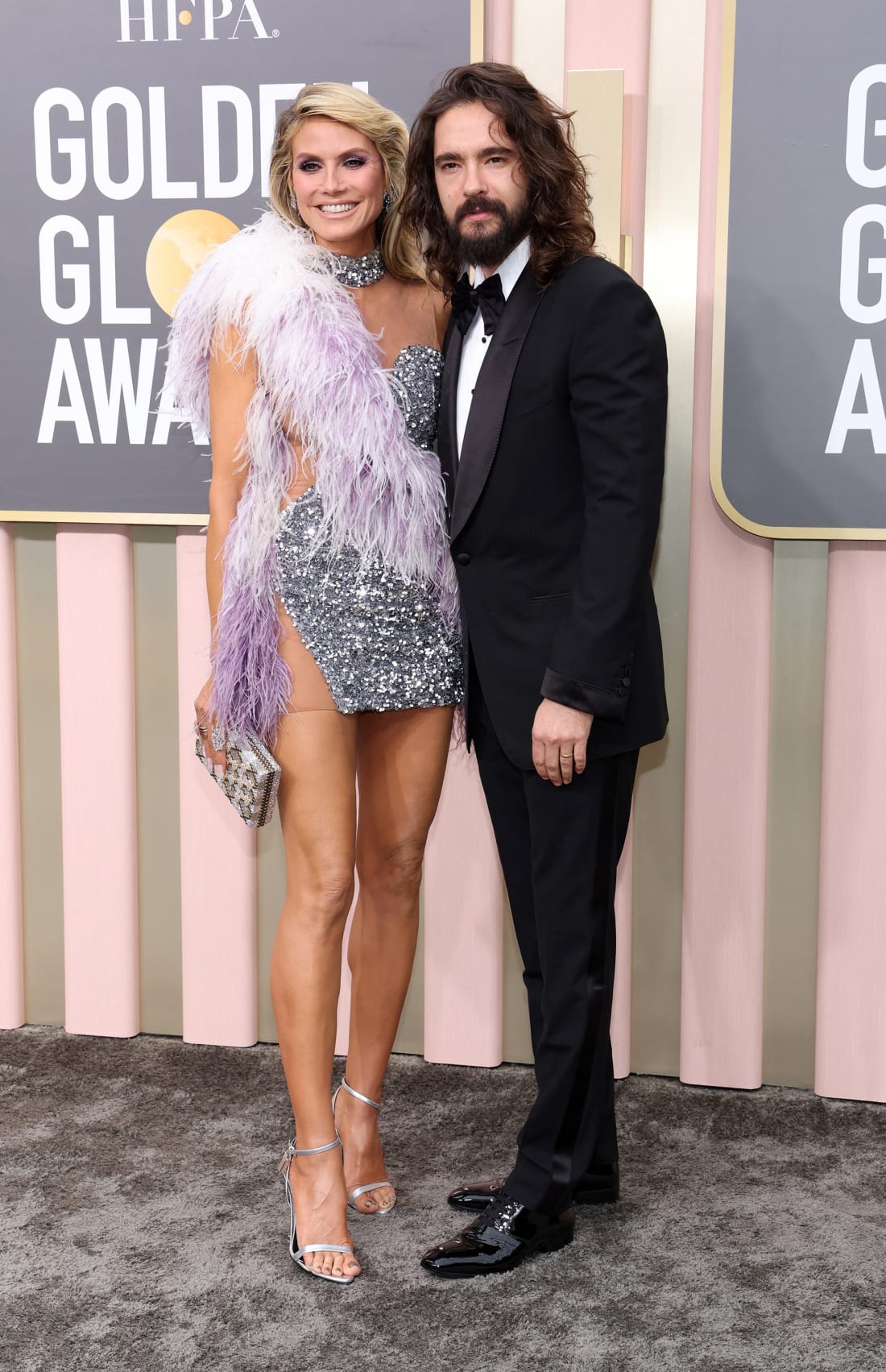 Heidi Klum, in an eye-catching look by Kevin Germanier, poses with husband Tom Kaulitz.