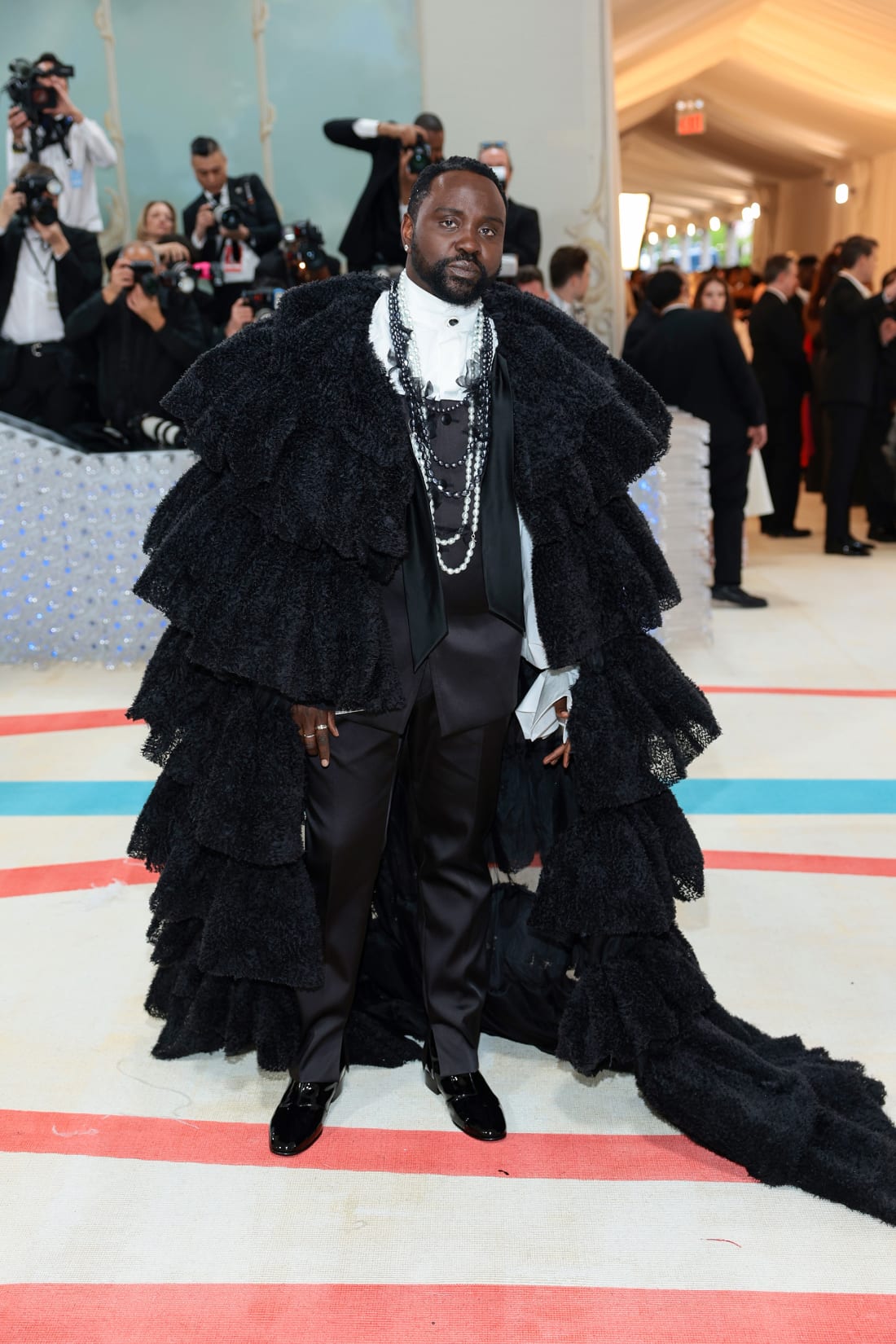 Actor Brian Tyree Henry layered pearls with his regal ensemble, designed by label Karl Lagerfeld.
