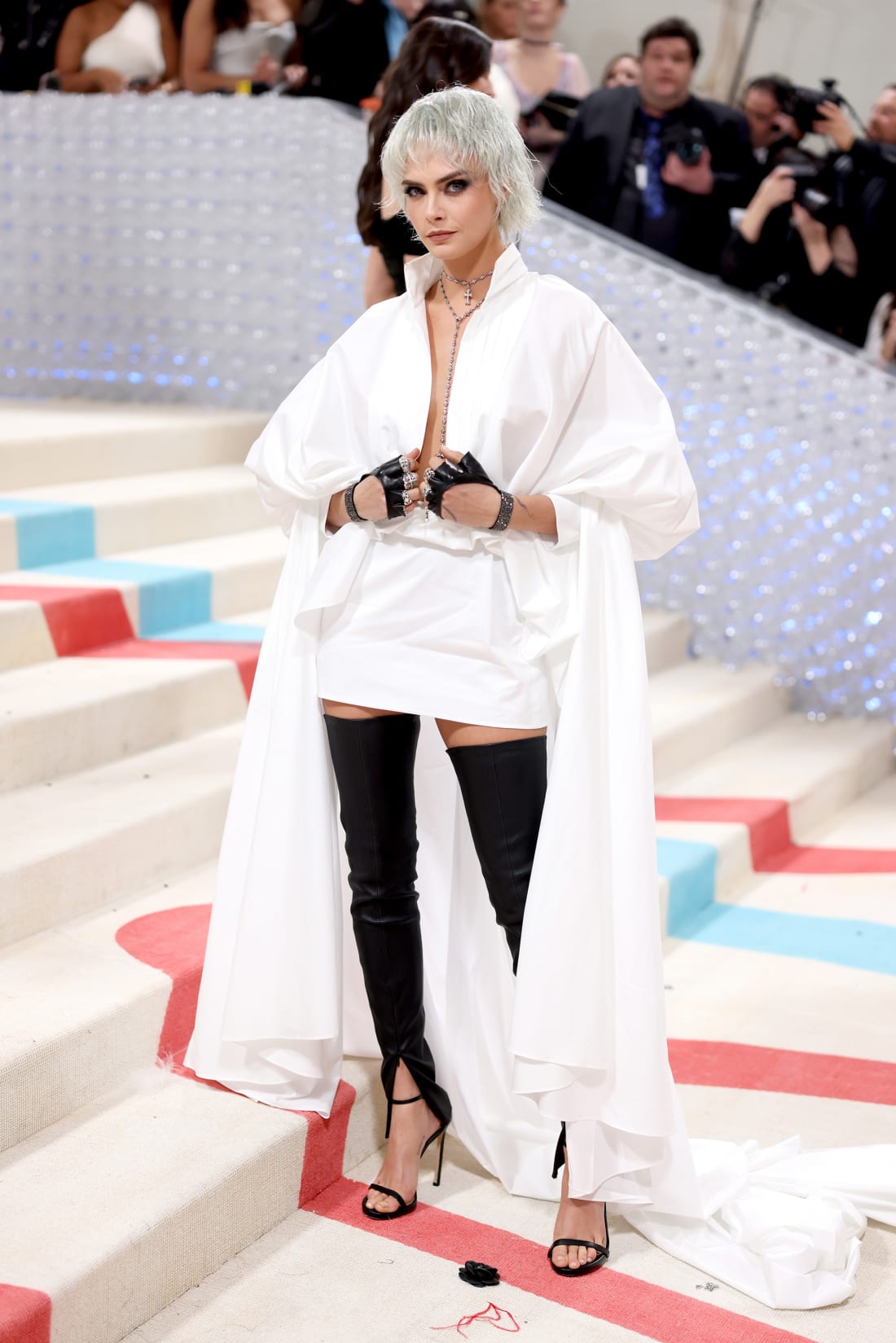 Like many tonight, Cara Delevingne put a spin on Lagerfeld's personal style, wearing fingerless moto gloves and a crisp white shirt from Lagerfeld's eponymous brand.
