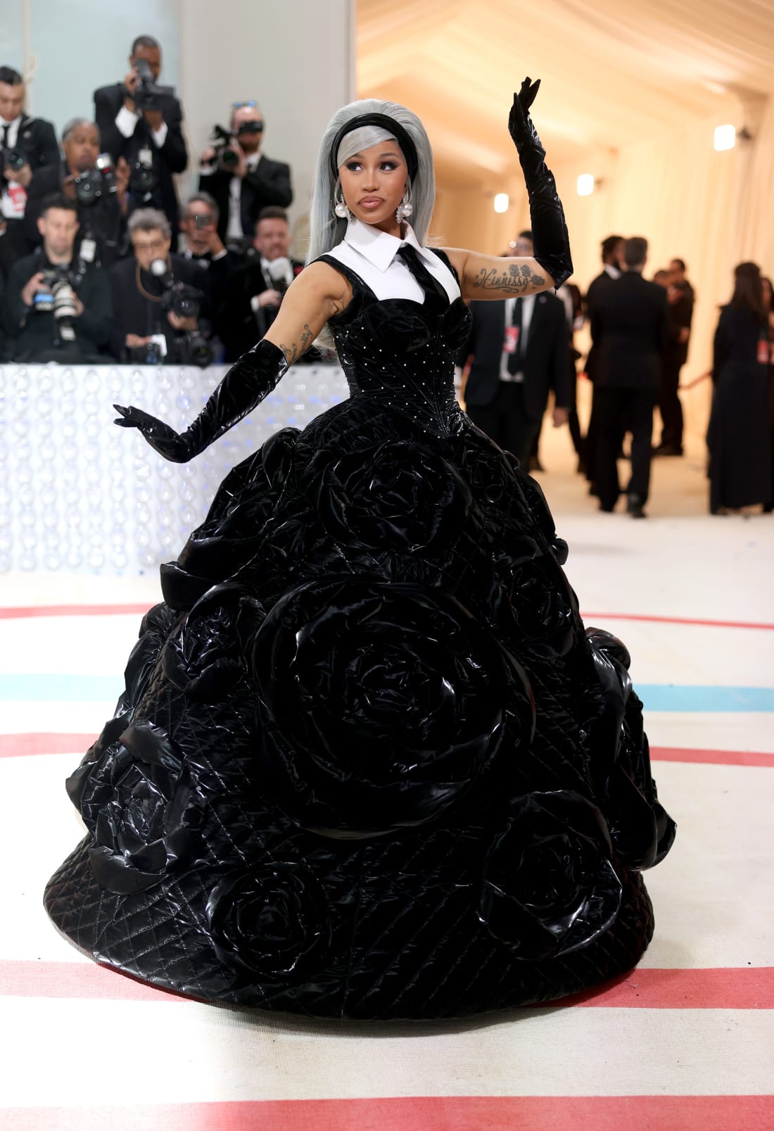 Cardi B wore two monumental couture looks Monday — including this one, by Chinese designer Chen Peng, that featured a corset, gloves and tie, a la Lagerfeld.
