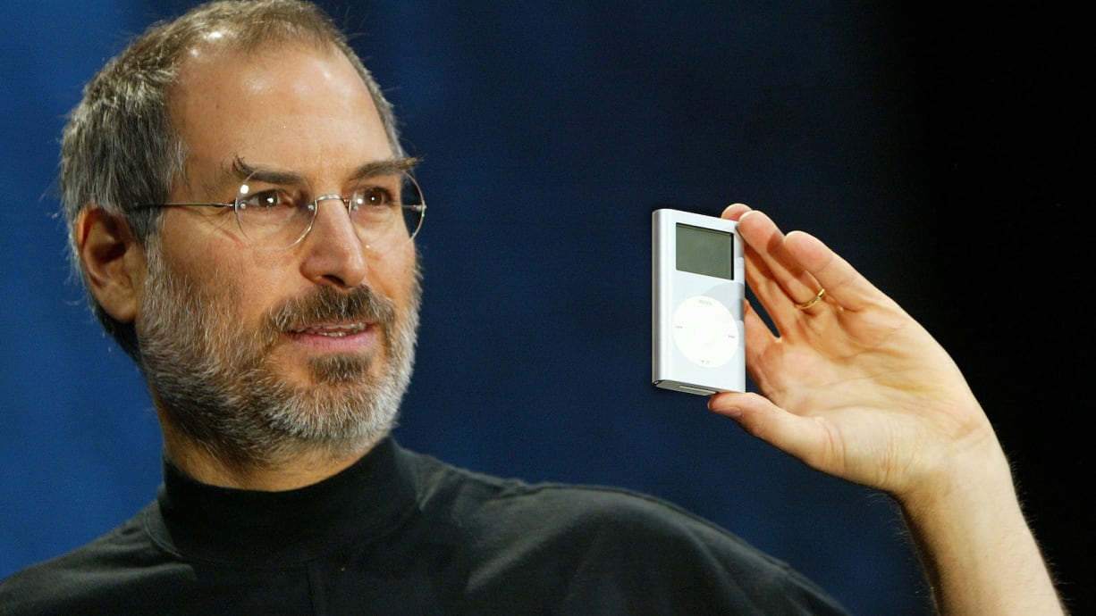 SAN FRANCISCO - JANUARY 6:  Apple CEO Steve Jobs holds a new mini iPod at Macworld January 6, 2004 in San Francisco. Jobs announced several new products including the new iLife 4 software and the Mini iPod. (Photo by Justin Sullivan/Getty Images)