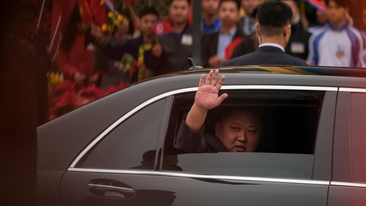 Kim Jong Un waves from his car upon his arrival in Vietnam on February 26, 2019 to attend the second US-North Korea summit. This does not appear to be one of the two vehicles discussed in the C4ADS report.