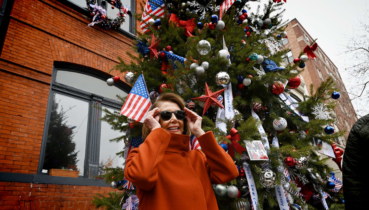 WASHINGTON, DC  DECEMBER 14: 
House Minority Leader Nancy Pelosi (D-Calif.) pays a visit to the Floriana Restaurant   in  Washington, DC. on December 14, 2018.
The restaurant made a Christmas tree named the Nancy Pelos Tree in her honor. Decorated with photos from her recent meeting with President Donald J. Trump.  
 (Photo by Marvin Joseph/The Washington Post via Getty Images)