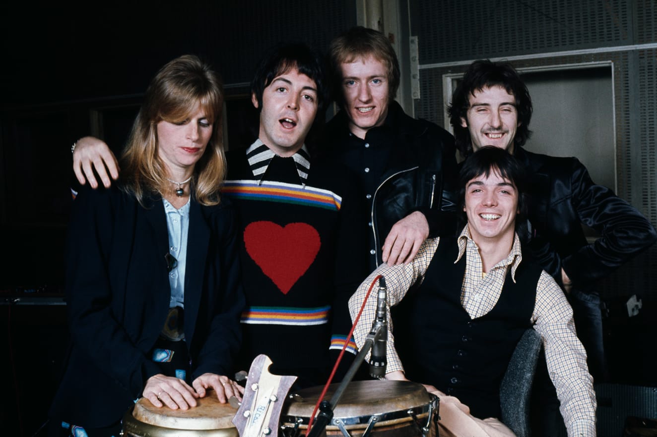 Graphic knits and striking shirts were a mainstay for the former Beatle, pictured here with British rock group Wings at Abbey Road Studios in 1974. Left to right: Keyboard player Linda McCartney, singer and bassist Paul McCartney, drummer Geoff Britton, guitarist Denny Laine and guitarist Jimmy McCulloch. 