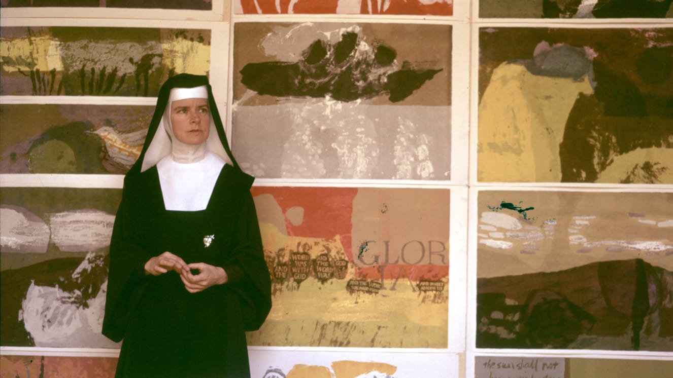 Sister Corita Kent in front of her pop art