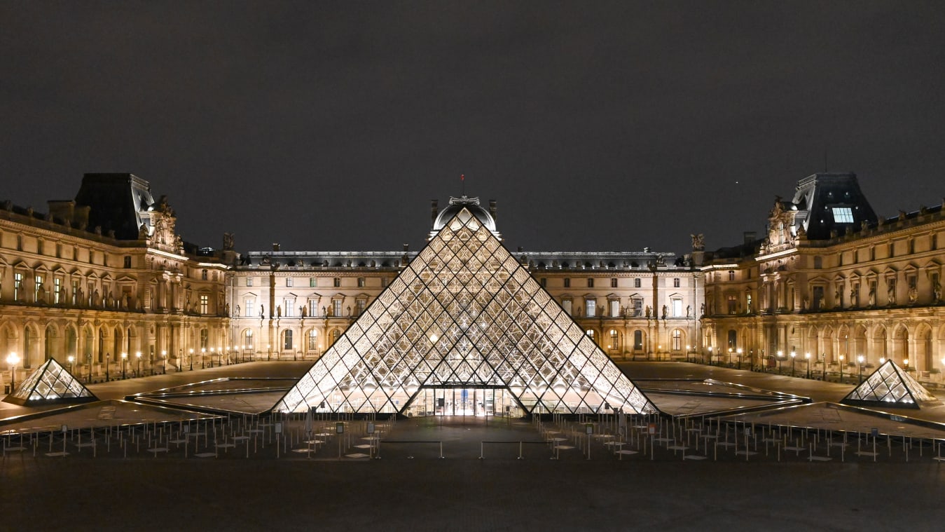 An elevated night view of the illuminated Louvre Museum in Paris during France's second lockdown on November 7, 2020. 