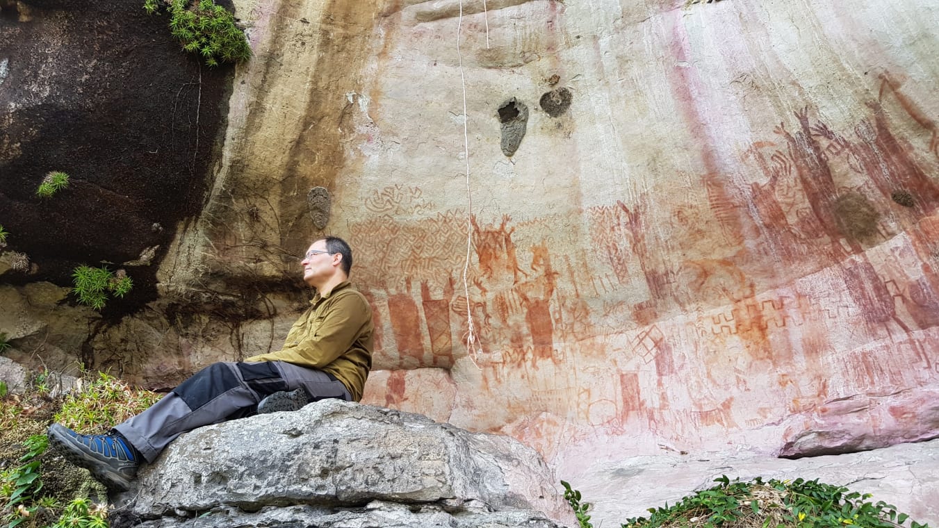 José Iriarte, professor of Archaeology at Exeter, at a wall depicting mastadons in the Amazon rainforest