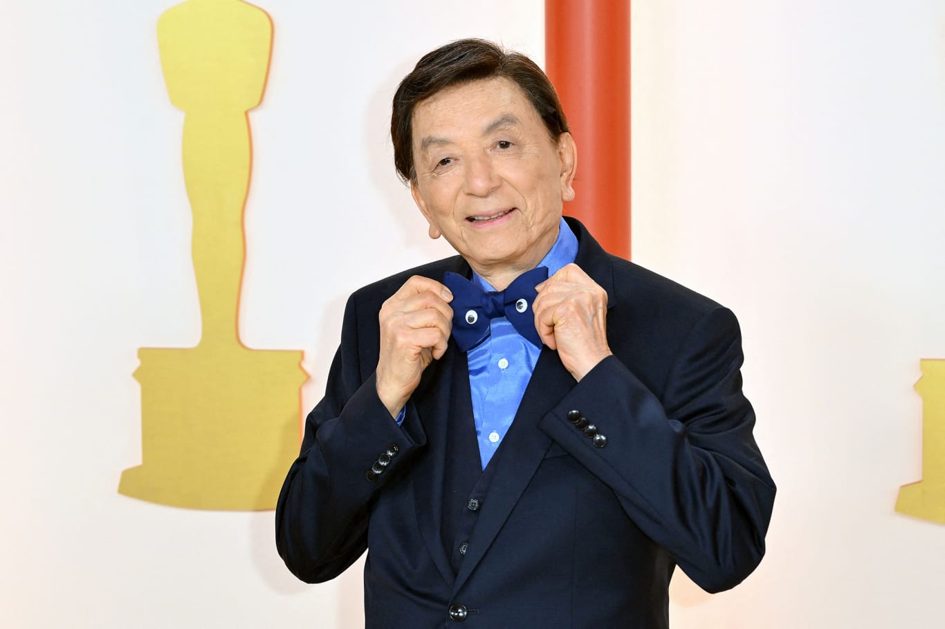 James Hong arrived wearing one of the night's boldest accessories: a blue bowtie adorned with — in a nod to 