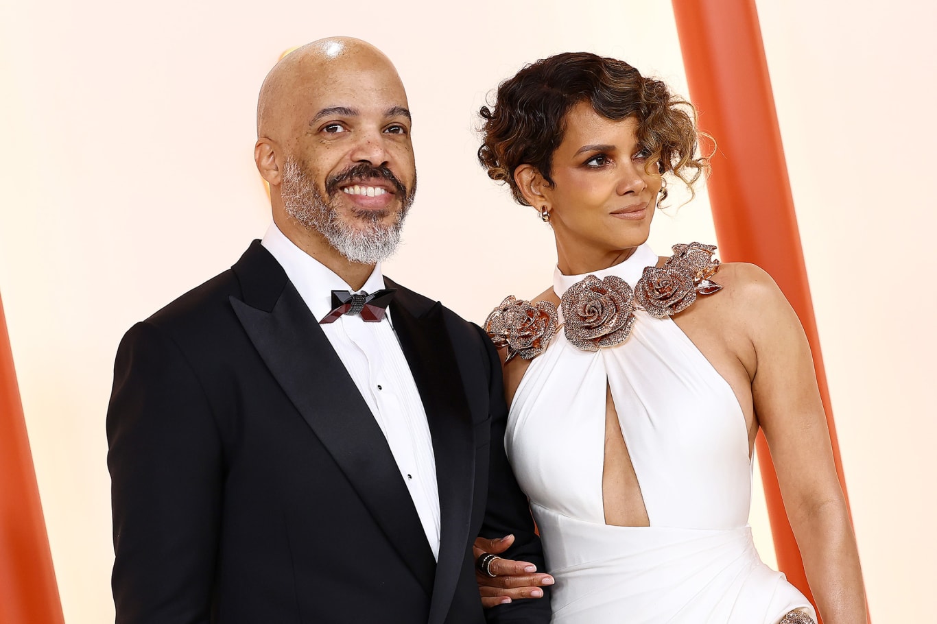 Also in white, Halle Berry wore Tamara Ralph Couture with rose-gold crystal floral jewelry at the neck and hip.