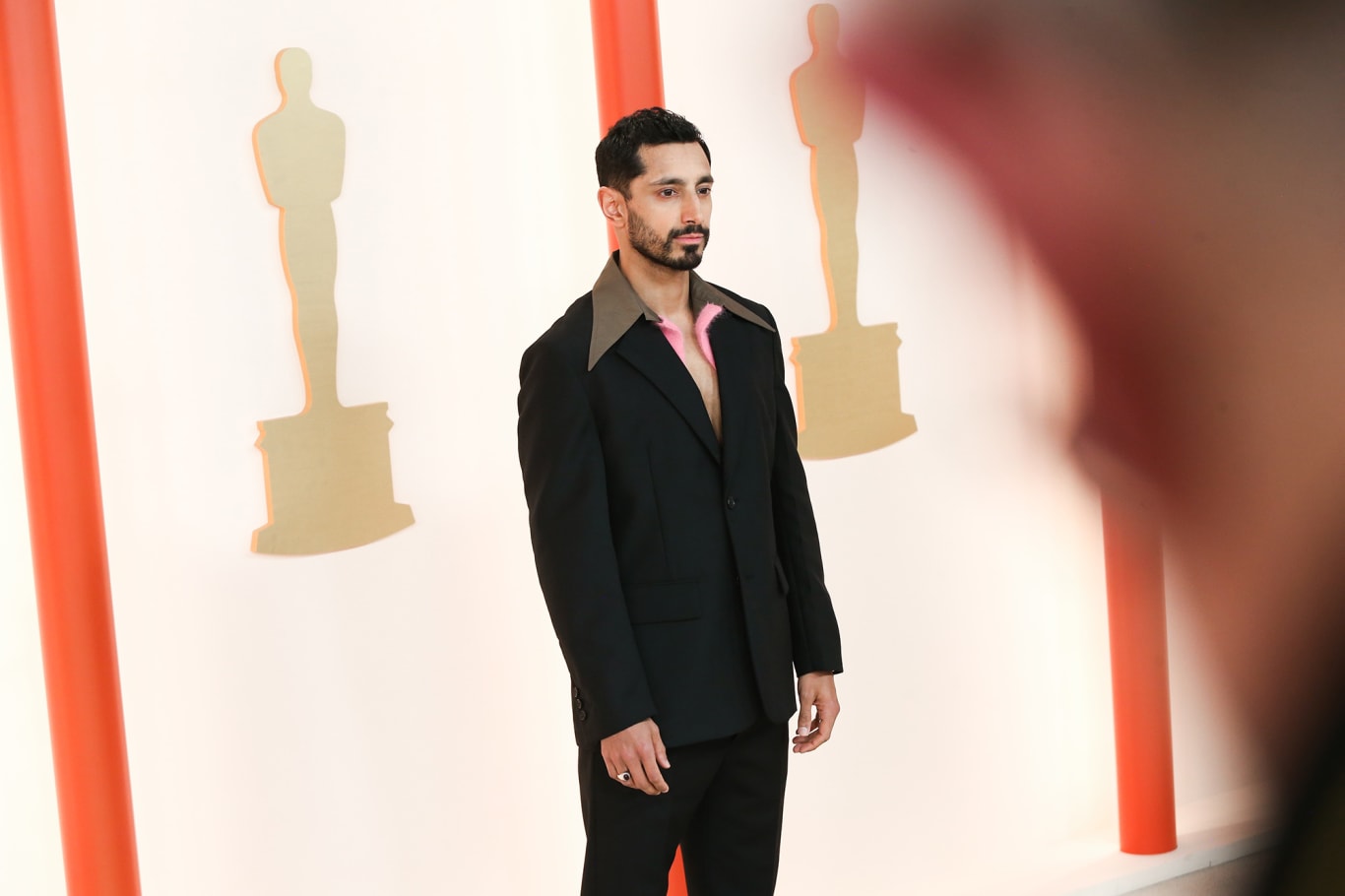 Riz Ahmed's wool and mohair Prada suit, from the label's Fall-Winter 2023 collection featured an unusual collar detail. 