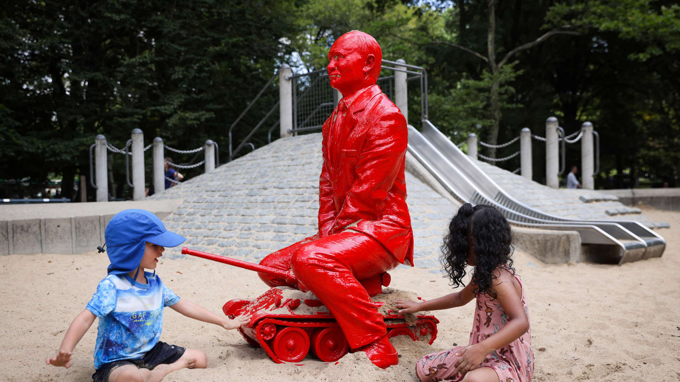Children play by a statue of Russian President Vladimir Putin riding a tank created by French artist James Colomina in Central Park in New York City, on August 2, 2022. 