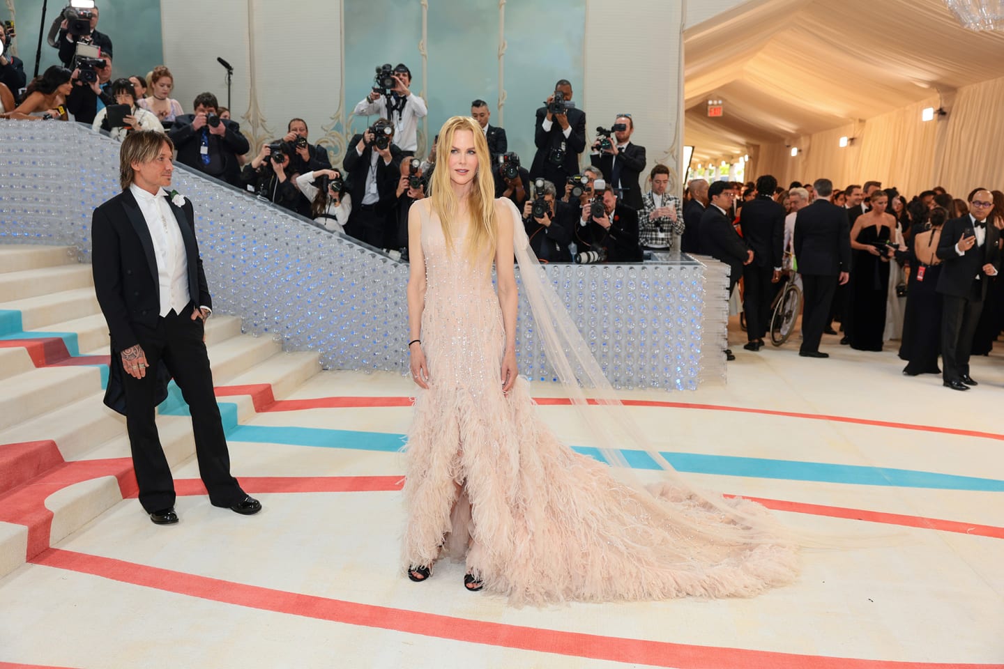Nicole Kidman arrived in a gown familiar to anyone with a TV in the 2000s: the same feathered blush gown she wore in the dramatic, romantic Chanel No 5 commercial directed by Baz Luhrmann.