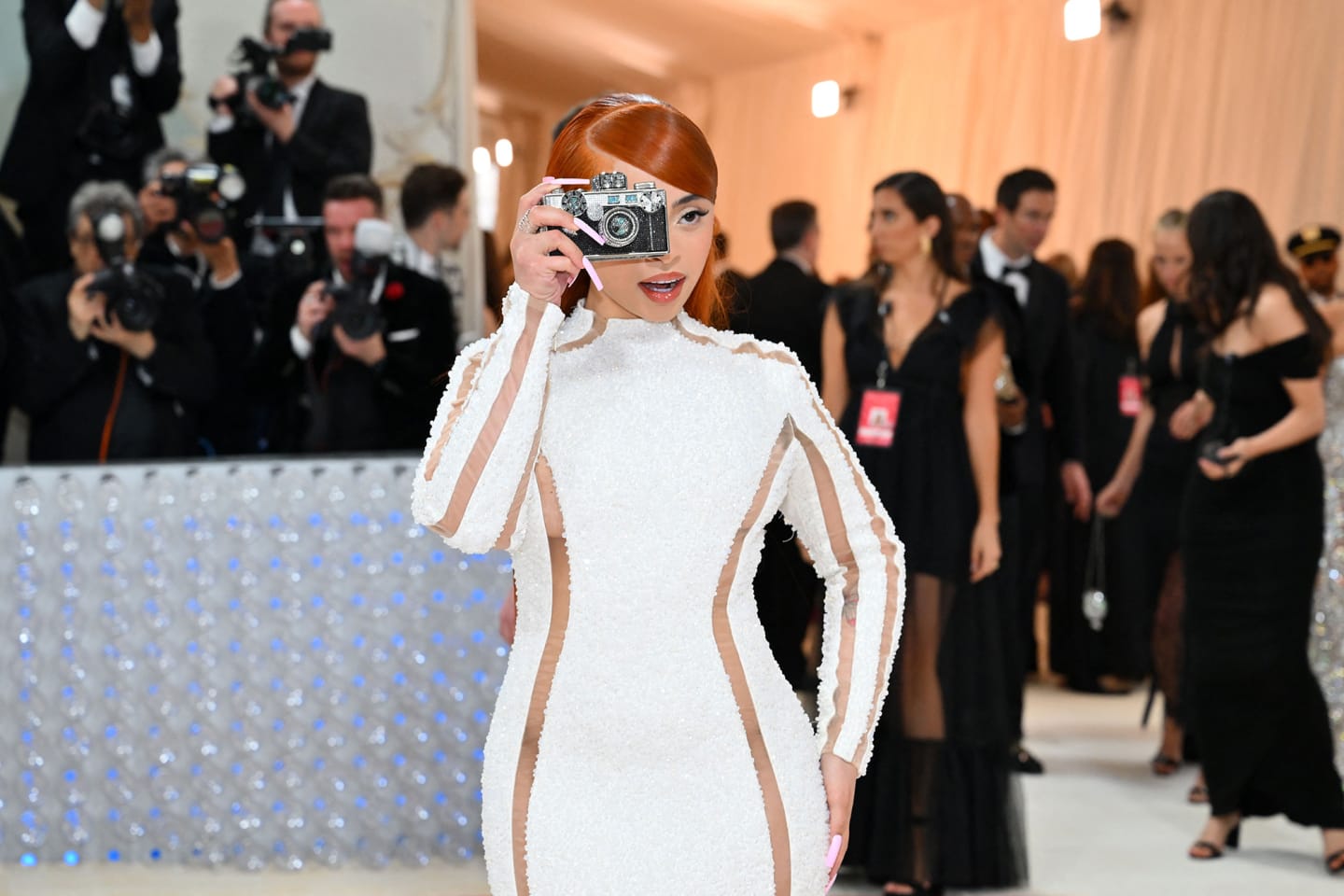 Rapper Ice Spice arrives at her first Met Gala in an all-white Balmain dress.