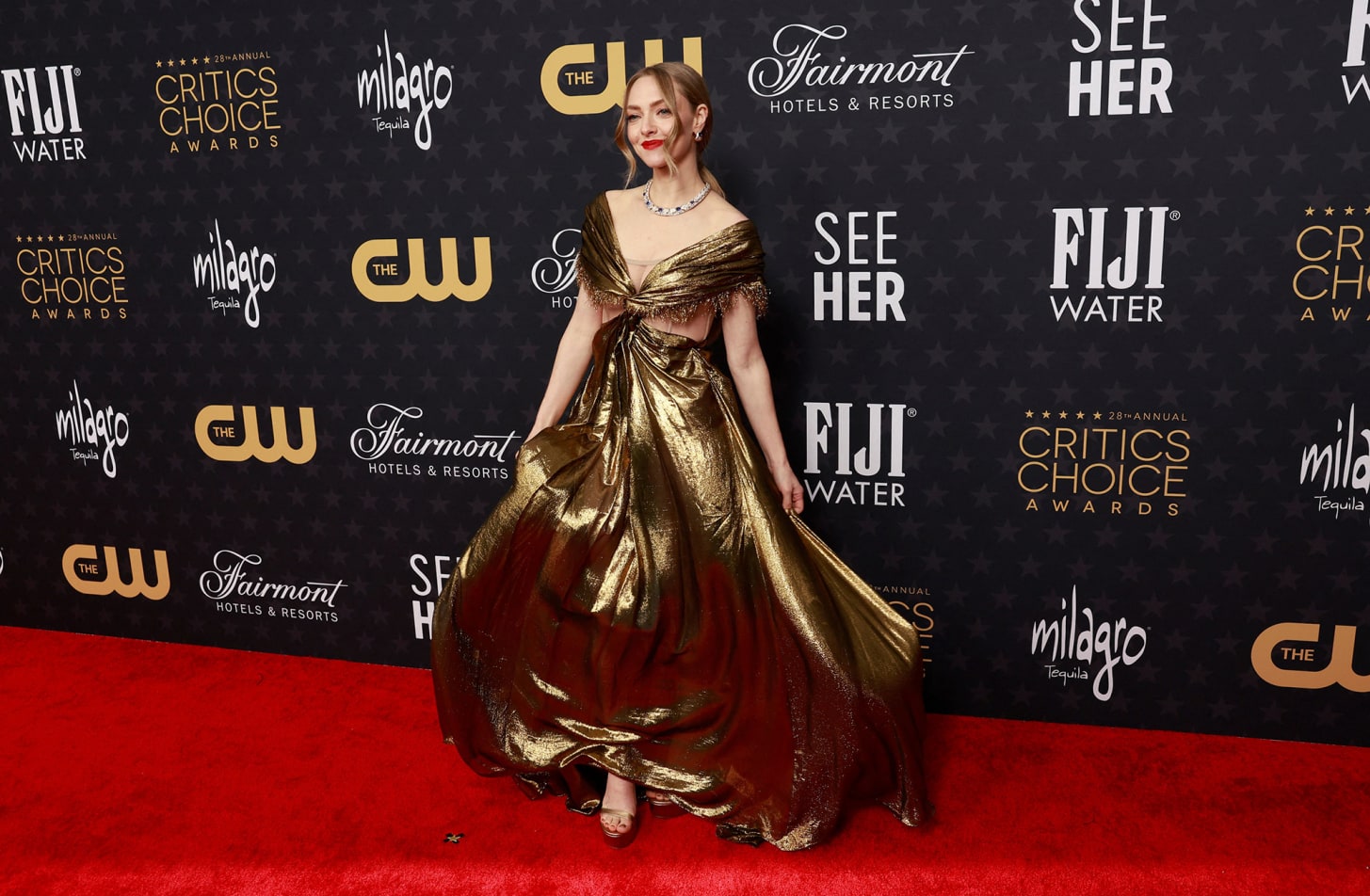 Amanda Seyfried's Dior Haute Couture dress was cut from a single piece of gold lamé chiffon. 