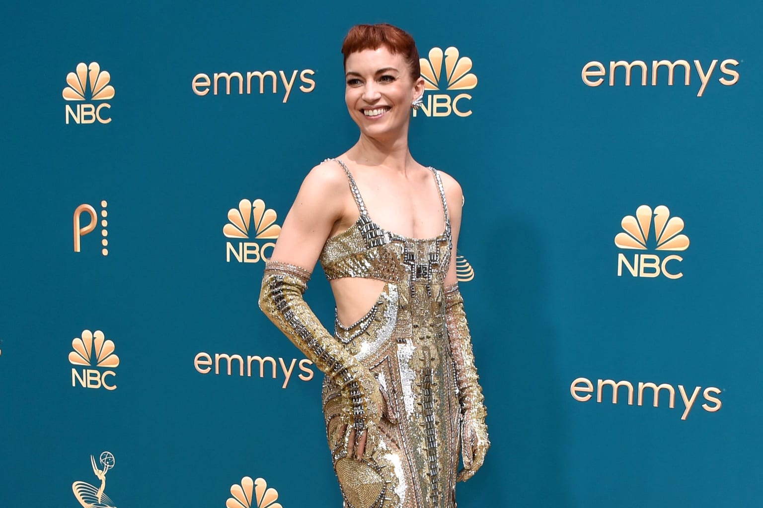 "Severance" star Britt Lower sparkled in a sequined cut-out gown and matching opera gloves. 