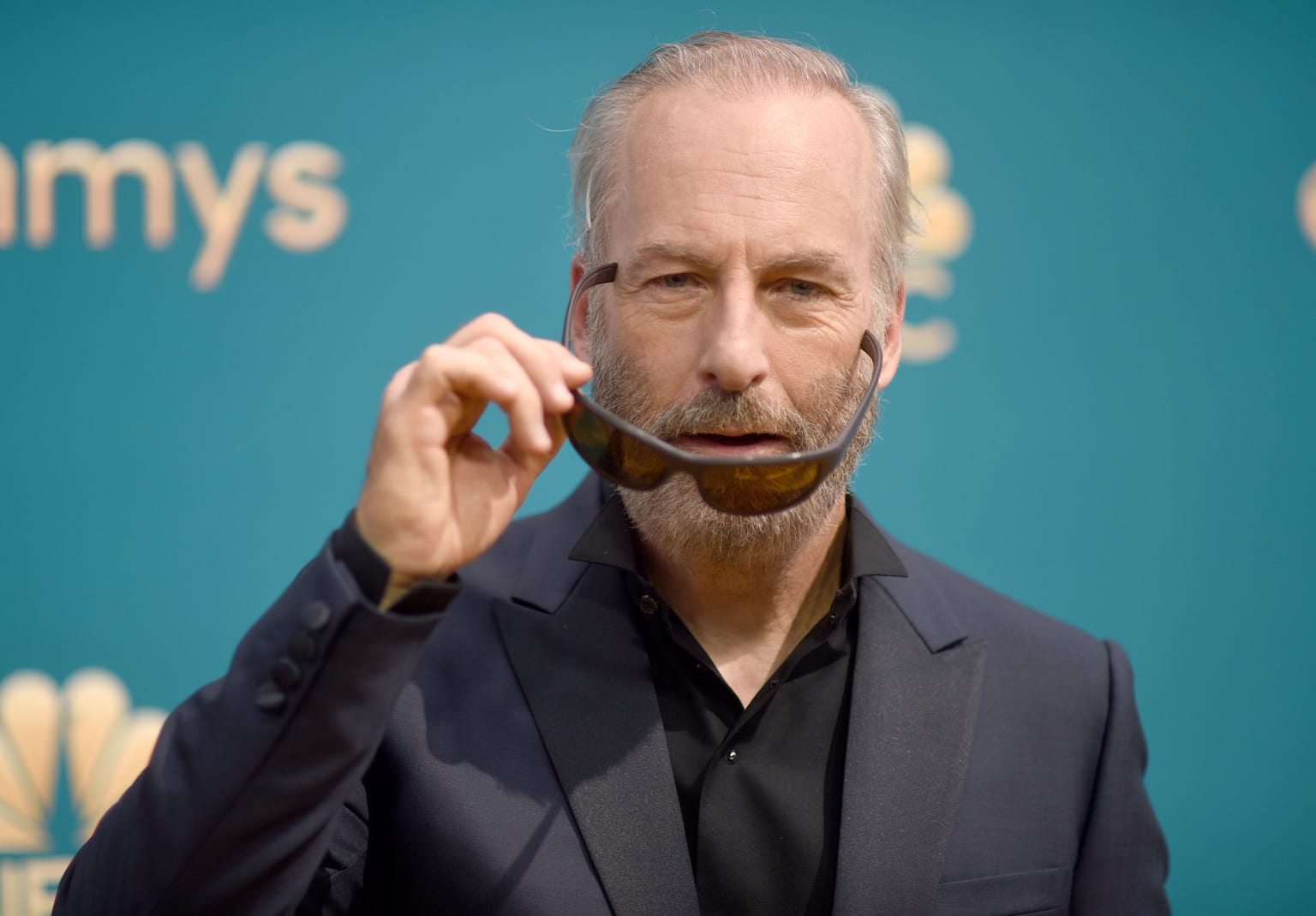 A bearded Bob Odenkirk in an all-black Dior outfit -- and shades. 