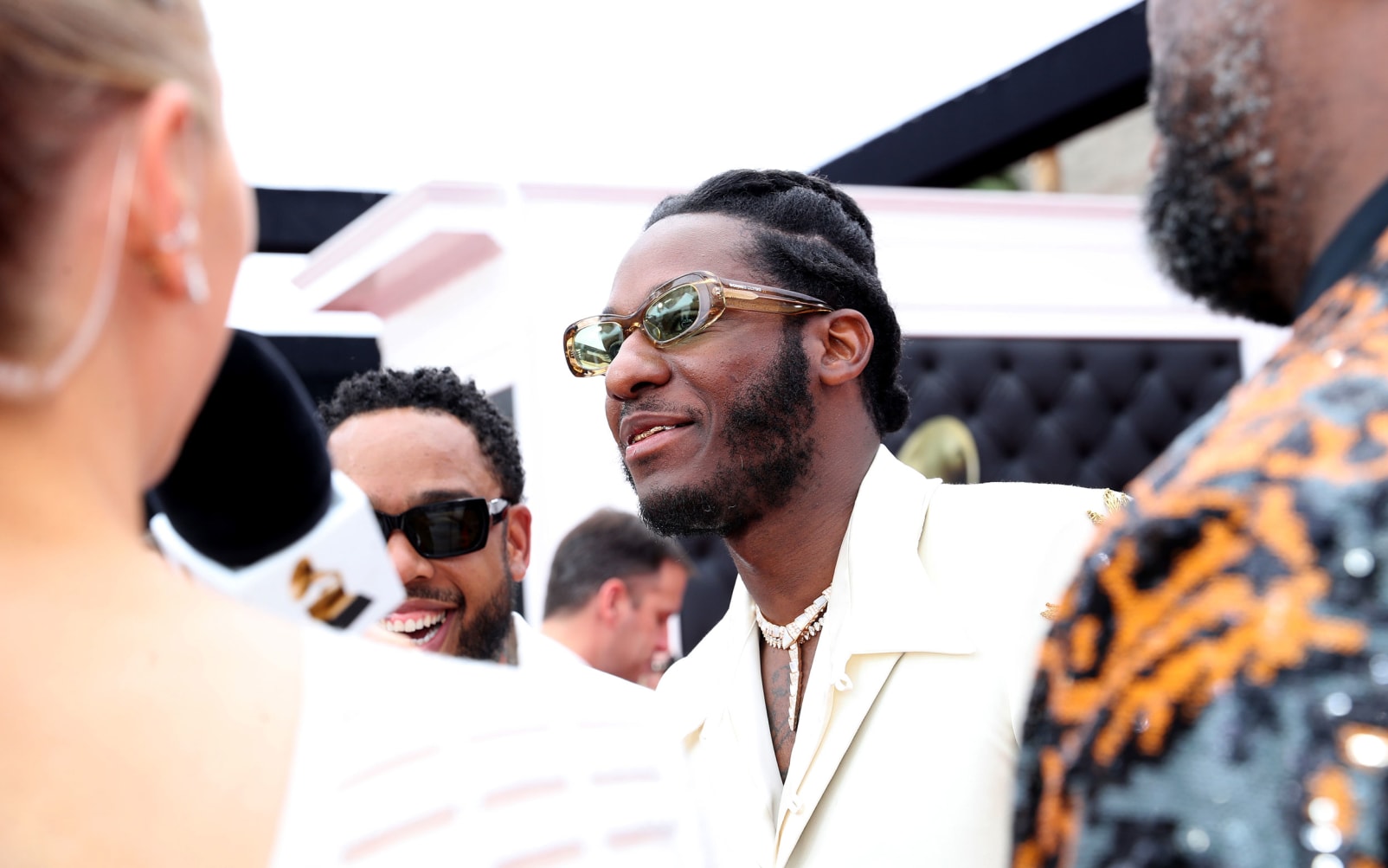 Soul singer Leon Bridges wore a white suit with gold embroidery, flared pants and jewelry by David Yurman.