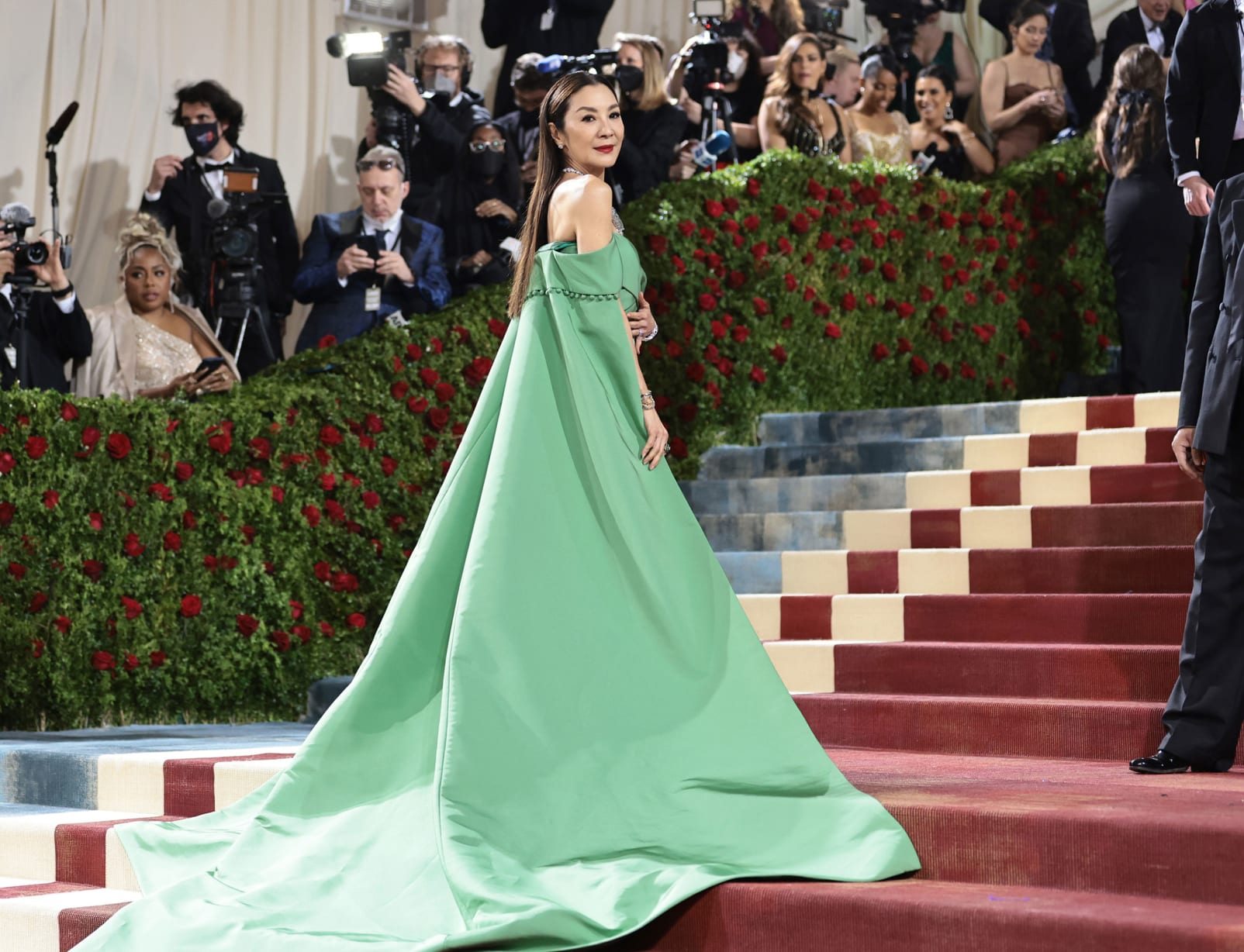 Michelle Yeoh wore a strapless, caped emerald green dress.