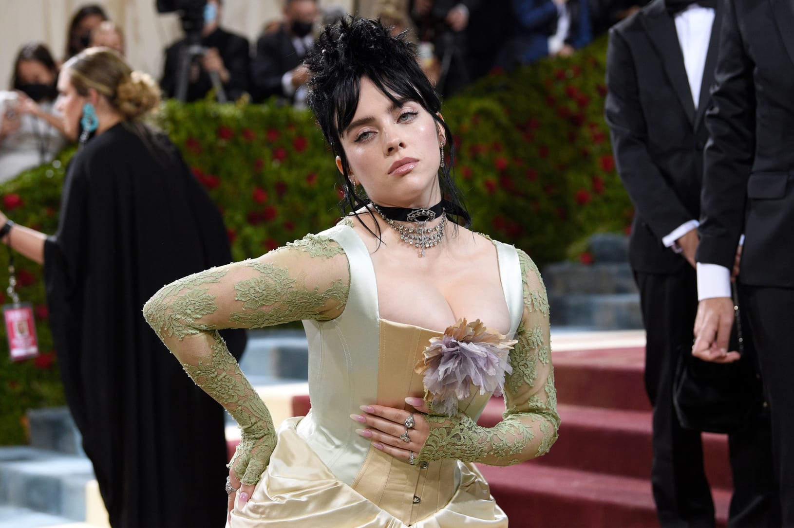 Billie Eilish stunned in an upcycled Gucci dress with a corseted bodice and sheer sea-foam-hued gloved sleeves. Every part of the dress was made from "already existing materials" she said, nodding to its eco-friendly design.