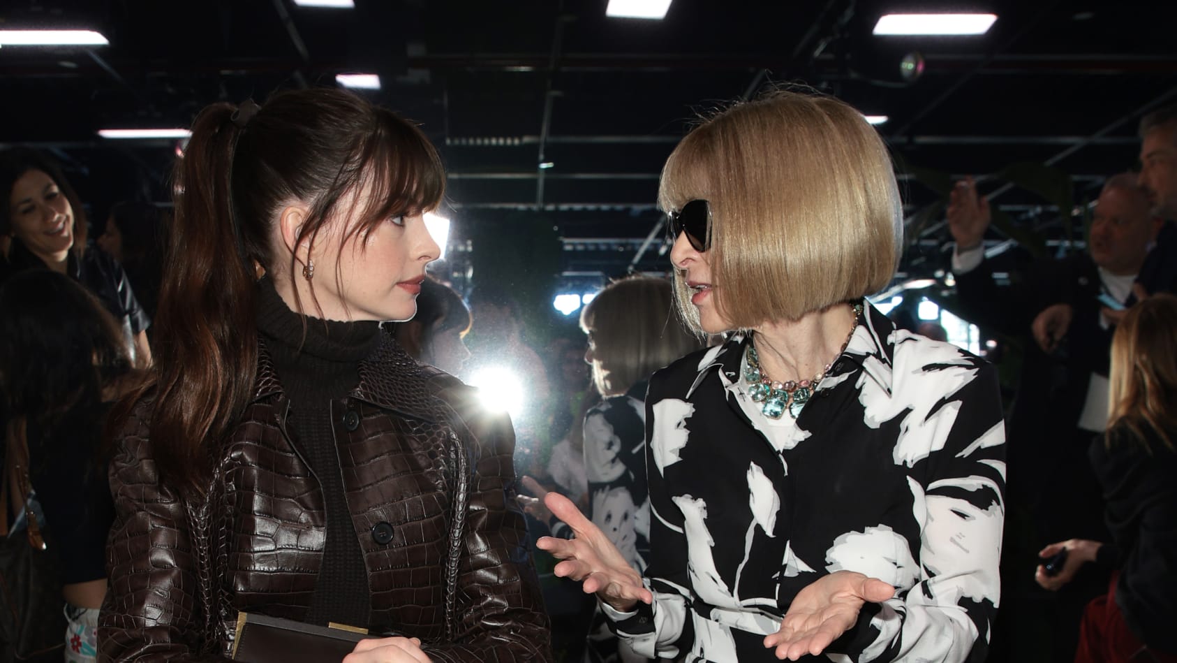 NEW YORK, NEW YORK - SEPTEMBER 14: (L-R) Anne Hathaway and Anna Wintour attend the Michael Kors Collection Spring/Summer 2023 Runway Show on September 14, 2022 in New York City. (Photo by Dimitrios Kambouris/Getty Images for Michael Kors)