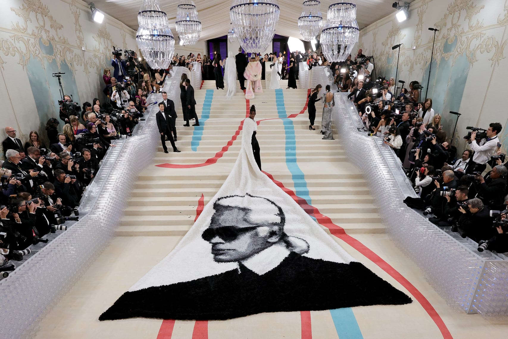 Actor Jeremy Pope's tribute to Lagerfeld was direct and enormous: a Balmain cape emblazoned with the designer's face.